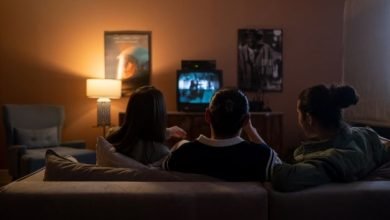 Students watching a movie on TV